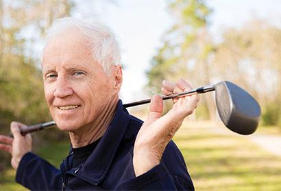 iStock-472216049_Man-with-golf-club_web4 Man Golfing