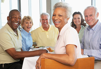 iStock_000019390084Medium-Friends-DinnerEdit4_WEB Group Eating in Restaurant